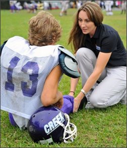 Athletic trainer on a football field